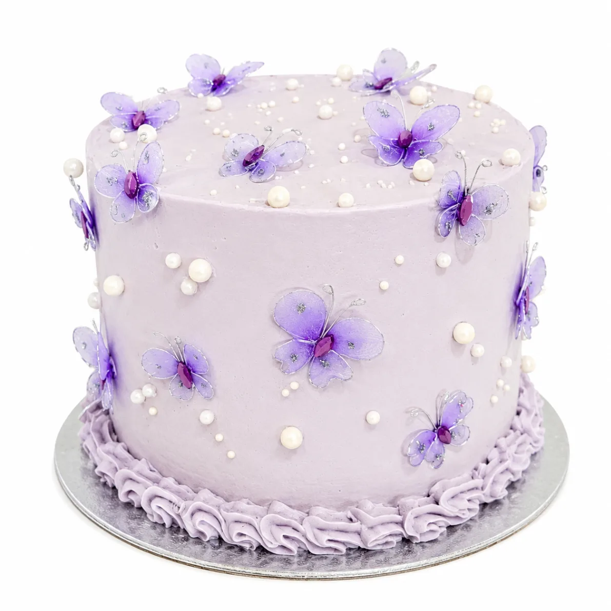 Lavender birthday cake with delicate purple butterflies and pearl details